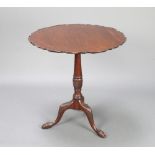 An Edwardian Chippendale style circular mahogany snap top tea table with bracketed border, raised on