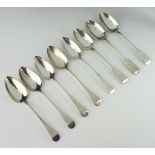 A George III silver table spoon London 1810, 7 others mixed dates, 550 grams