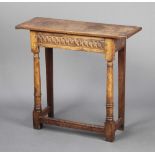 A late 19th century rectangular carved oak side table formed of old timber, raised on turned and