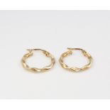 A pair of 9ct yellow gold twist hoop earrings 0.9 grams