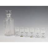 A circular Waterford Crystal decanter and stopper and six liqueur glasses