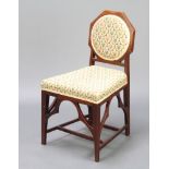 An Edwardian Chippendale style mahogany bedroom chair with shaped back and wedge shaped seat