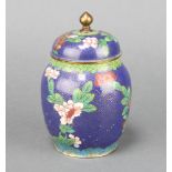 A blue ground and floral patterned cloisonne enamelled jar and cover 16cm x 6cm