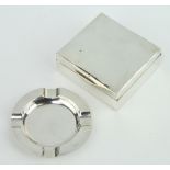 A circular silver ashtray Birmingham 1935 and a square silver cigarette box 8cm (marks rubbed) The