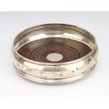 A silver coaster with hardwood base London 1988, 13cm