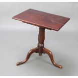 A 19th Century rectangular mahogany reading table with adjustable ratchet top, raised on a turned
