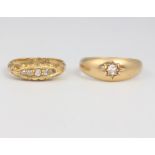 An 18ct yellow gold single stone diamond ring, a 5 stone ditto, 7.5 grams, sizes M and O