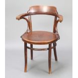 A Thonet bentwood carver chair, the base brande Thonet and with label There is light water damage to