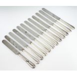 A set of 12 silver handled dinner knives with beaded decoration