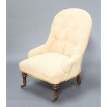 A Victorian metal framed nursing chair upholstered in yellow corduroy material