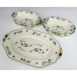 A Royal Doulton floral decorated octagonal meat plate, 2 smaller ditto and 2 dishes, the handles