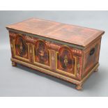 A 19th Century Eastern European painted pine coffer with hinged lid, the interior fitted a candle