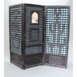 An Anglo Indian pierced and ebonised 3 fold dressing screen, the centre section with watercolour