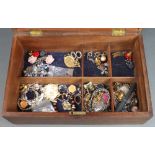 A mahogany jewellery box containing a small amount of costume jewellery