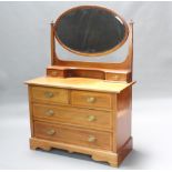 An Edwardian bleached inlaid mahogany dressing chest with oval bevelled plate mirror, fitted 2 glove