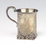 A Victorian silver mug with engraved inscription and flowers on scroll feet, London 1851, 100 grams