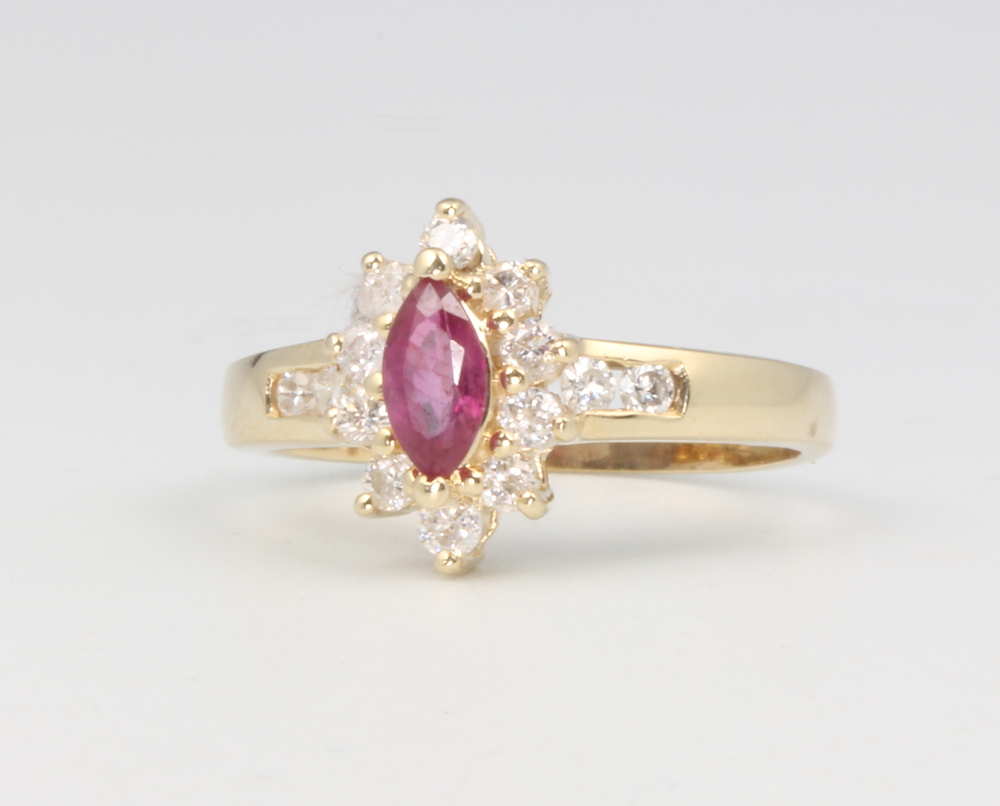 A 14ct yellow gold ruby and diamond cluster ring size L, 2.4 grams