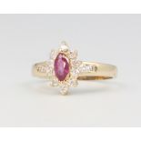 A 14ct yellow gold ruby and diamond cluster ring size L, 2.4 grams