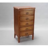 A Continental oak pedestal chest of 5 drawers with iron drop handles, serpentine outline, raised