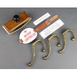 Three brass London South Western Railway hat and coat hooks, a Southern Railways oak desk blotter, a