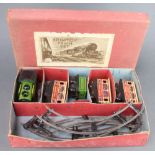 A Wells of London Brimtoy train set comprising clockwork locomotive tender, 3 carriages and a