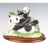 A Franklin Mint group of pandas - Pride and Joy 19cm, on a wooden stand