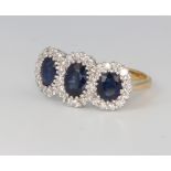 An 18ct yellow gold triple sapphire and diamond cluster ring, sapphire 1.88ct, diamonds 0.7ct,