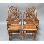A set of 6 17th/18th Century style arched and carved ladder back dining chairs with solid seats