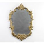 An Italian style shaped plate wall mirror contained in a decorative gilt frame 58cm h x 39cm w Chips