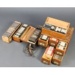 A pine table top filing chest containing approx. 126 black and white photographic slides together