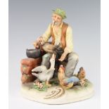 A Capodimonte figure of a farmer feeding chickens and geese 20cm