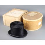 A gentleman's black silk top hat by Samuel Mortlock and Sons of London size 6 7/8, together with a
