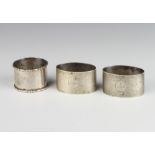A pair of silver napkin rings Birmingham 1933 and 1 other, 92 grams