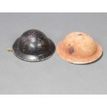 A Second World War Royal Artillery steel helmet with flash, painted to the side, together with a