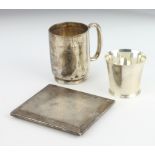 A silver engine turned cigarette case, a mug and tott, 280 grams
