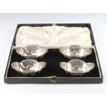 A set of 4 silver bon bon dishes with pierced decoration, London 1926 and 1927, 112 grams, cased