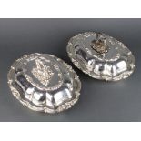 A pair of silver plated entree sets