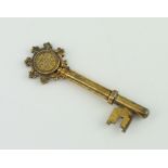 A silver gilt presentation key with engraved presentation inscription, 24 grams