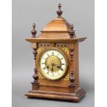 Junghams, a striking bracket clock with enamelled dial and Roman numerals contained in a walnut case