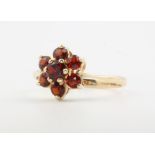 A 9ct yellow gold garnet cluster ring 1.3 grams, size L