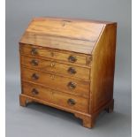 A Georgian bleached mahogany bureau, the fall front revealing a well fitted interior above 4