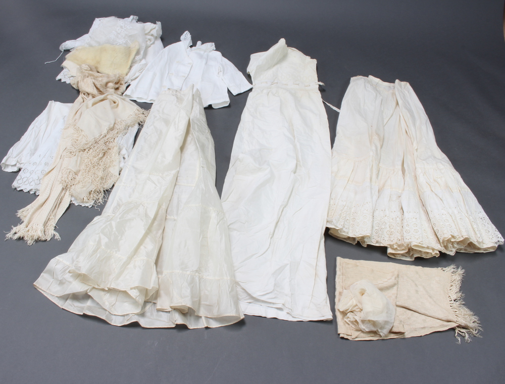 A child's white cotton double breasted jacket, a white cotton dress and other items of clothing