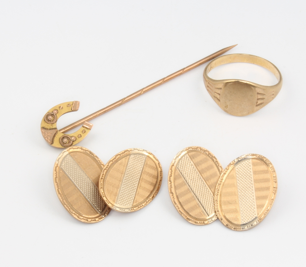 A pair of 9ct yellow gold cufflinks, a ditto ring and a tie pin, 9 grams