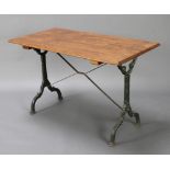 A Victorian style garden table with rectangular oak top raised on wrought iron supports 69cm h x