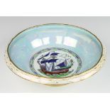 A Mintons lustre bowl decorated with a galleon 29cm There is some minor wear to the gilding