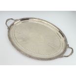 A Victorian oval silver 2 handled tray with beaded rim, demi-fluted decoration and presentation