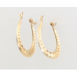 A pair of 9ct yellow gold engraved hoop earrings, 1 gram