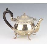 A silver teapot with hoof feet and ebony handle, London 1919, gross 378 grams