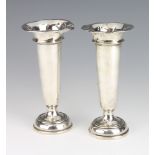 A pair of silver tapered posy vases London 1931, 16cm Both are dented