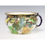 A Doulton Burslem chamber pot decorated with flowers